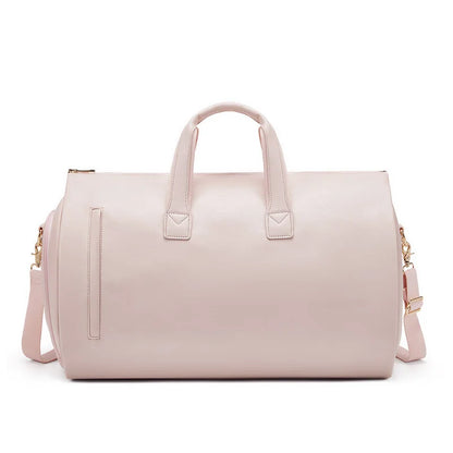 Pink duffel bag with gold accents on a white background