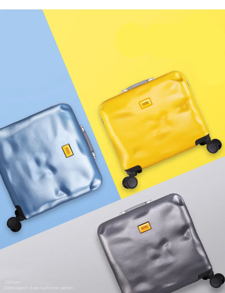 Three metallic suitcases in blue, yellow, and gray on a multicolored background