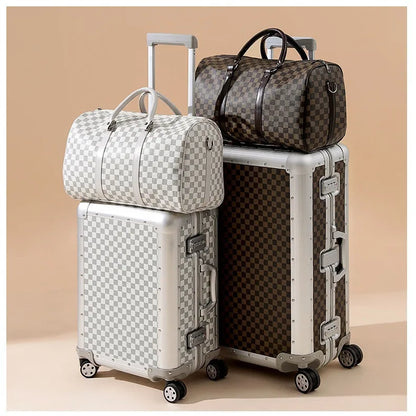 Set of checkered suitcases and duffel bags on a beige background