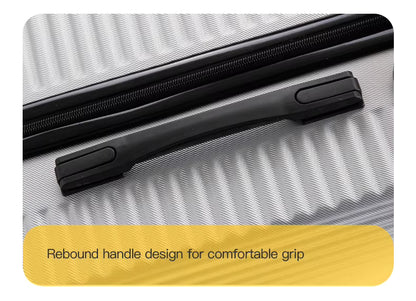 Close-up of a suitcase handle on a textured surface with a yellow label.