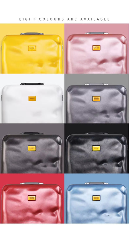 Grid of eight suitcases in different colors with a yellow tag on each.