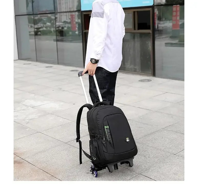 Person pulling a black rolling backpack on a sidewalk.