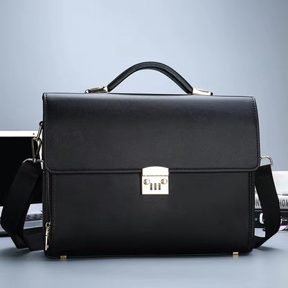Black leather briefcase with a silver lock on a gray background