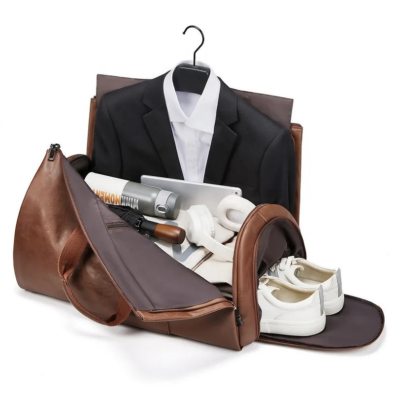 Brown leather travel bag with a suit, shoes, and other items on a white background