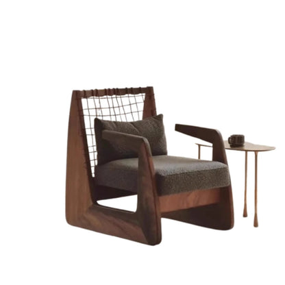 Modern brown armchair with a small table on a white background