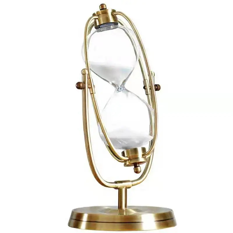 Gold hourglass-shaped lamp on a white background