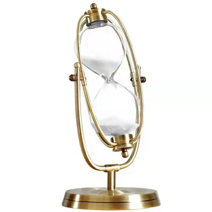 Gold hourglass-shaped lamp on a white background