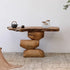 Wooden console table with rustic design against a white wall