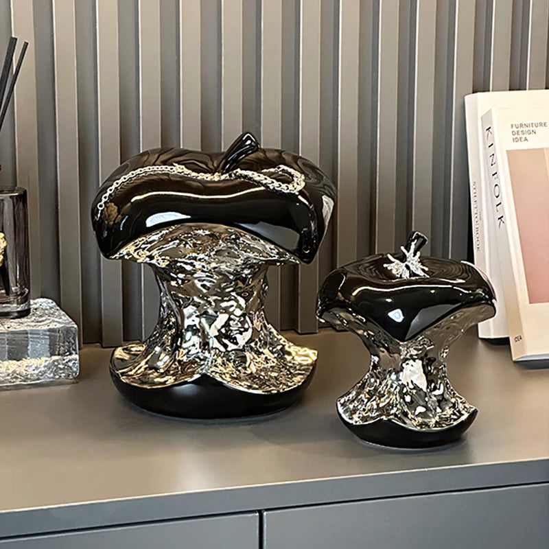 Decorative mushroom-shaped objects on a surface with a striped wall in the background