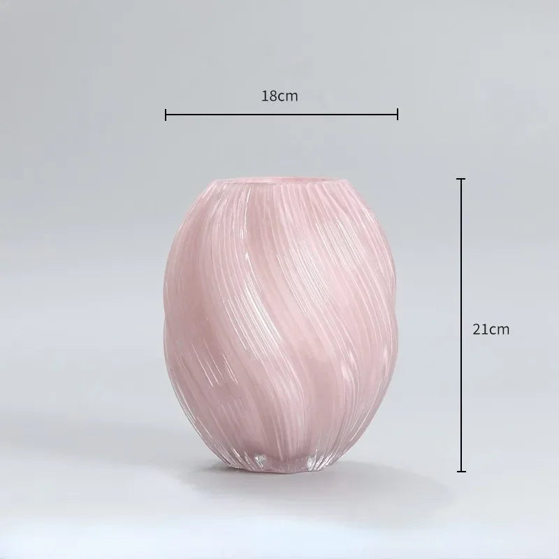 Pink glass vase with dimensions on a light gray background
