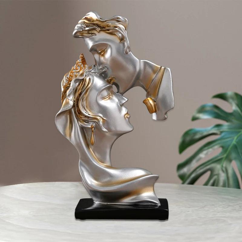 Pair of kissing sculptures in a minimalist living room setup.