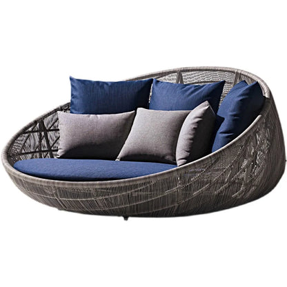Elegant outdoor garden round bed chair with decorative pillows.