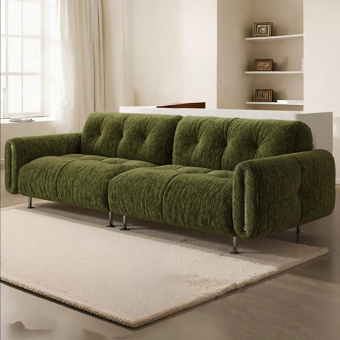 Green sofa in a living room setting with neutral decor