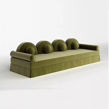 Green sofa with curved backrest on a white background