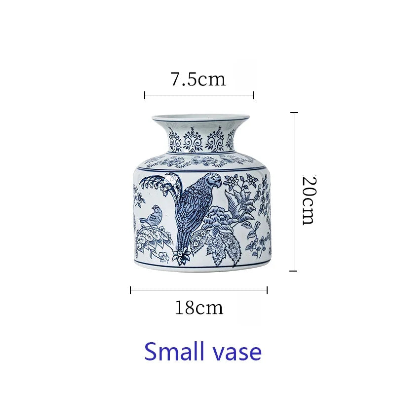 Ceramic vase with blue floral and bird design, shown with measurements on a white background.