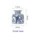 Ceramic vase with blue floral and bird design, shown with measurements on a white background.