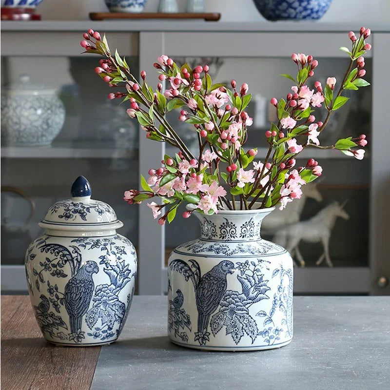 Two decorative vases with floral arrangement on a table