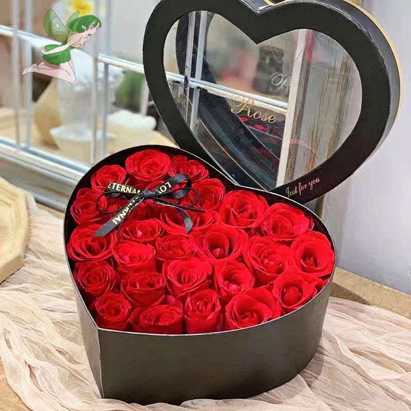 Close-up of velvet roses in a heart-shaped box.