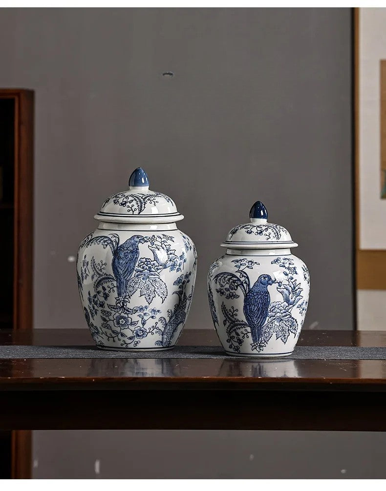 Two blue and white ceramic jars with lids on a wooden surface.