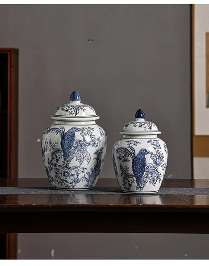 Two blue and white ceramic jars with lids on a wooden surface.