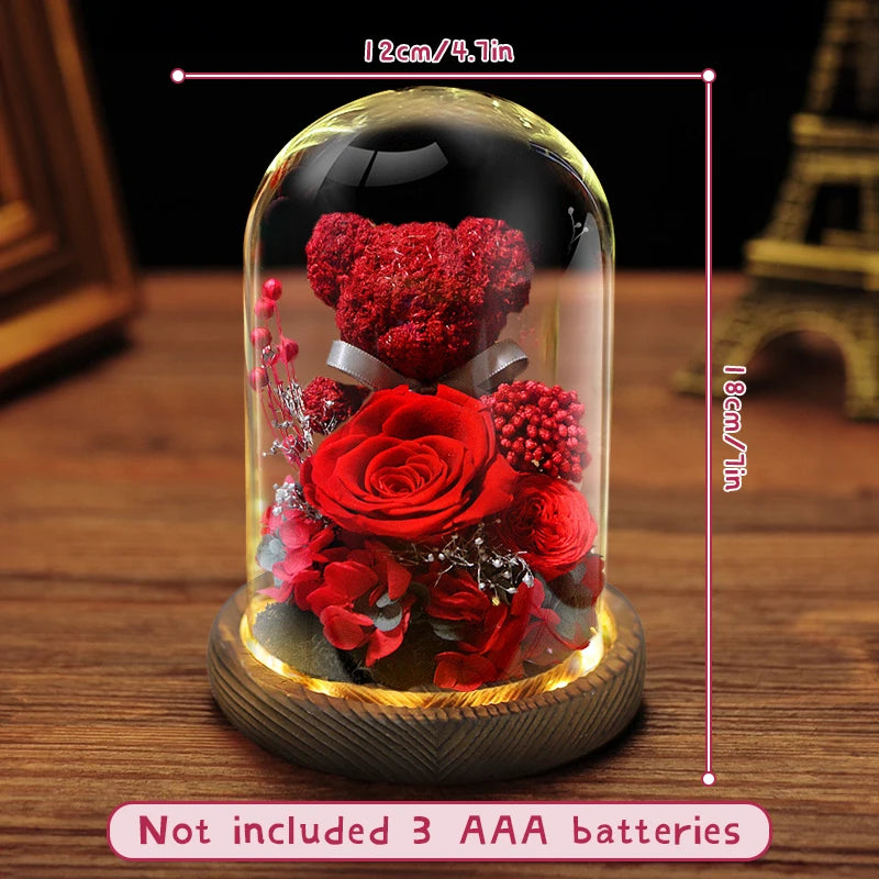 Preserved flower bear displayed on a bedside table.