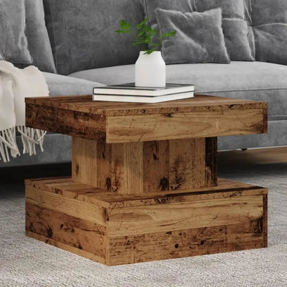 Wooden coffee table with books and a vase in a living room setting