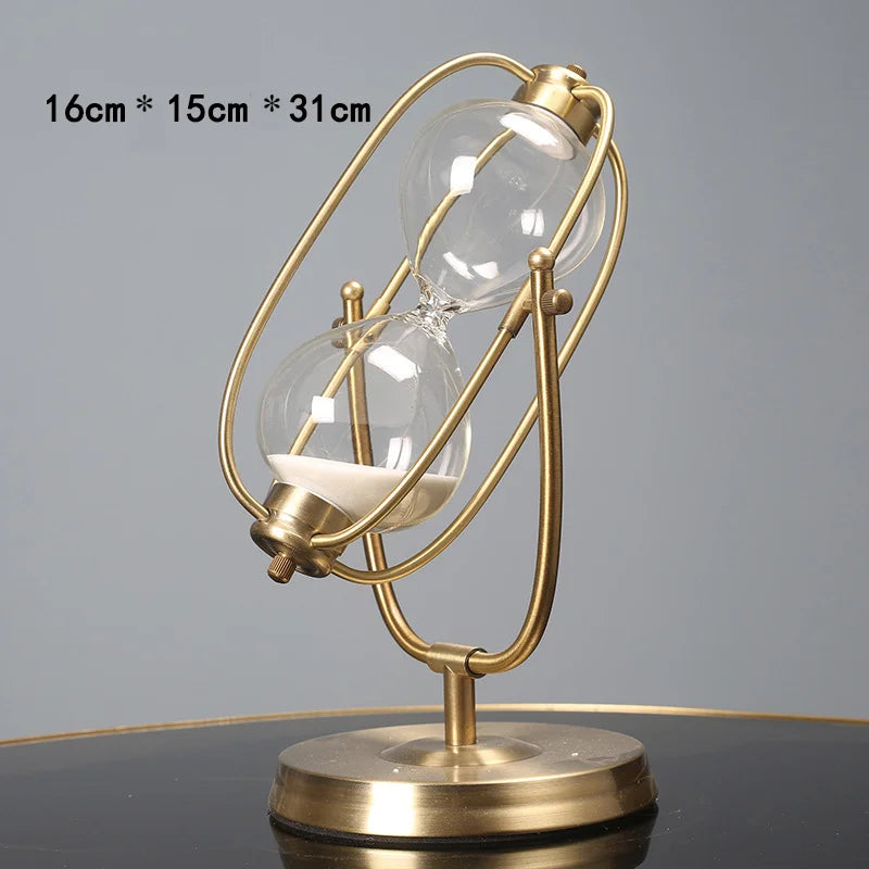 Gold hourglass-shaped lamp on a gray background