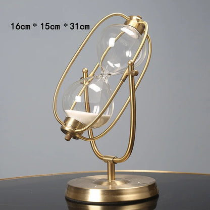 Gold hourglass-shaped lamp on a gray background