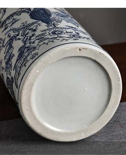 Close-up of a ceramic vase with blue floral patterns on a dark surface