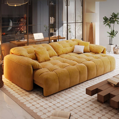 Yellow sofa in a modern living room with a desk and plants.