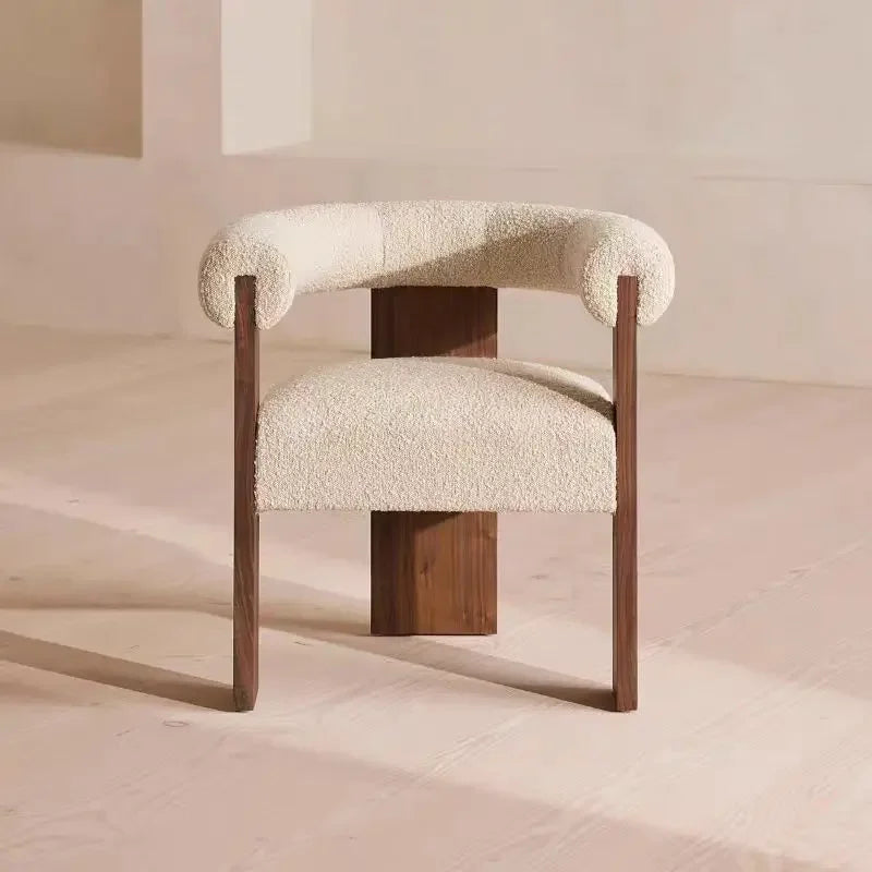 Elegant modern dining chair crafted from solid wood, featuring supportive handrails and soft lambskin.