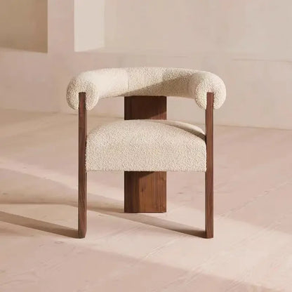 Elegant modern dining chair crafted from solid wood, featuring supportive handrails and soft lambskin.