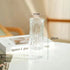Clear glass vase with dimensions on a blurred background