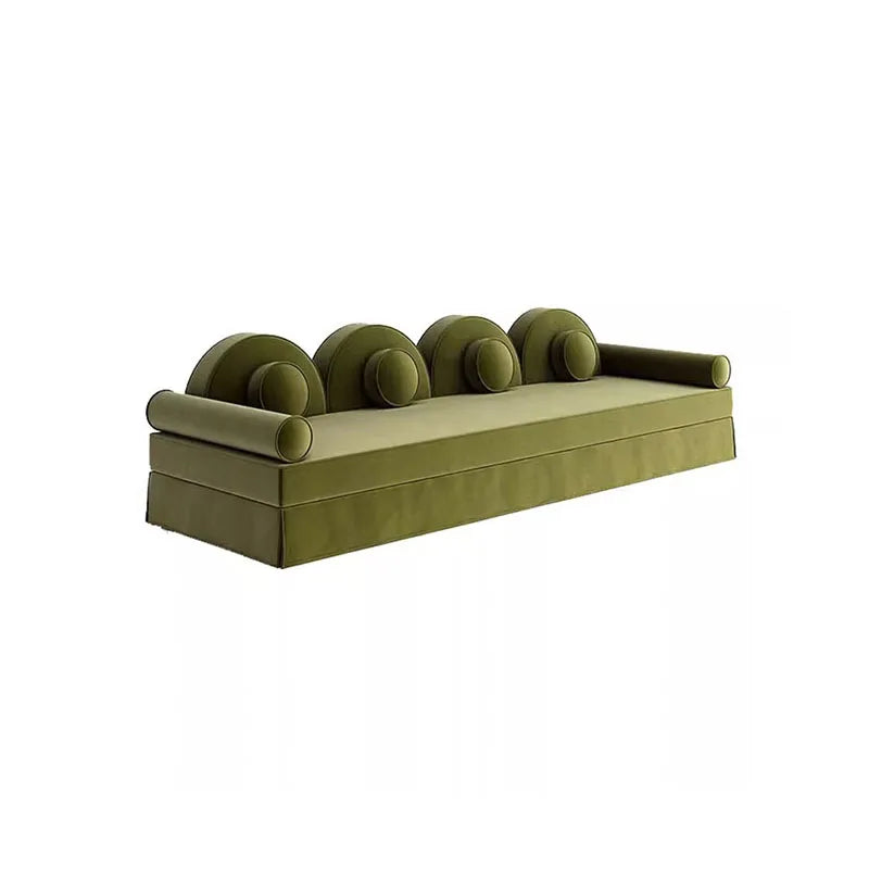 Green sofa with curved backrest on a white background
