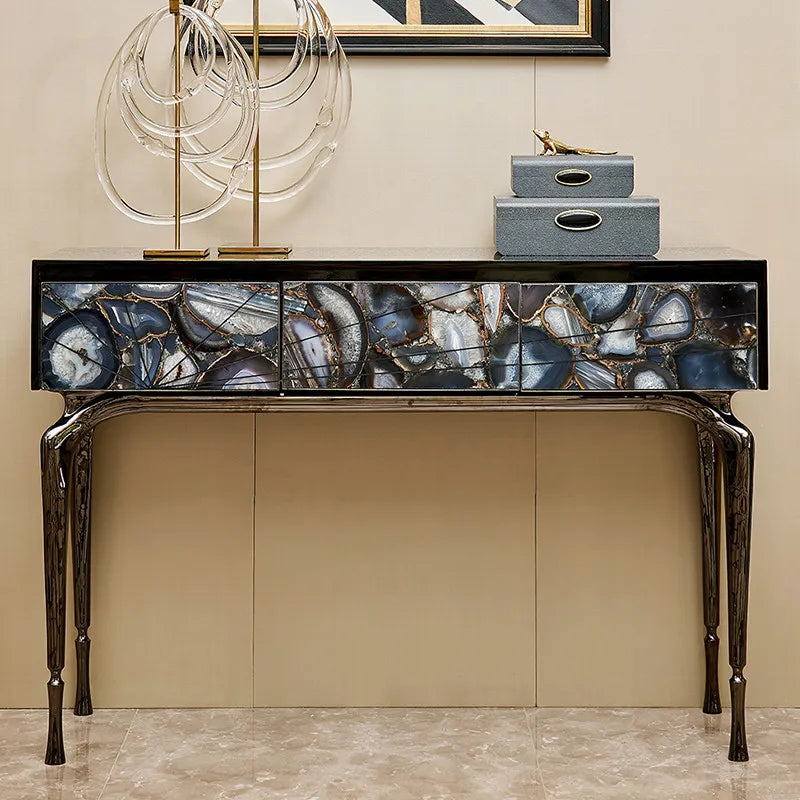 Decorative console table with agate-like surface in a room setting