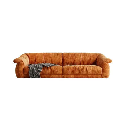 Brown sofa with a blanket on a white background