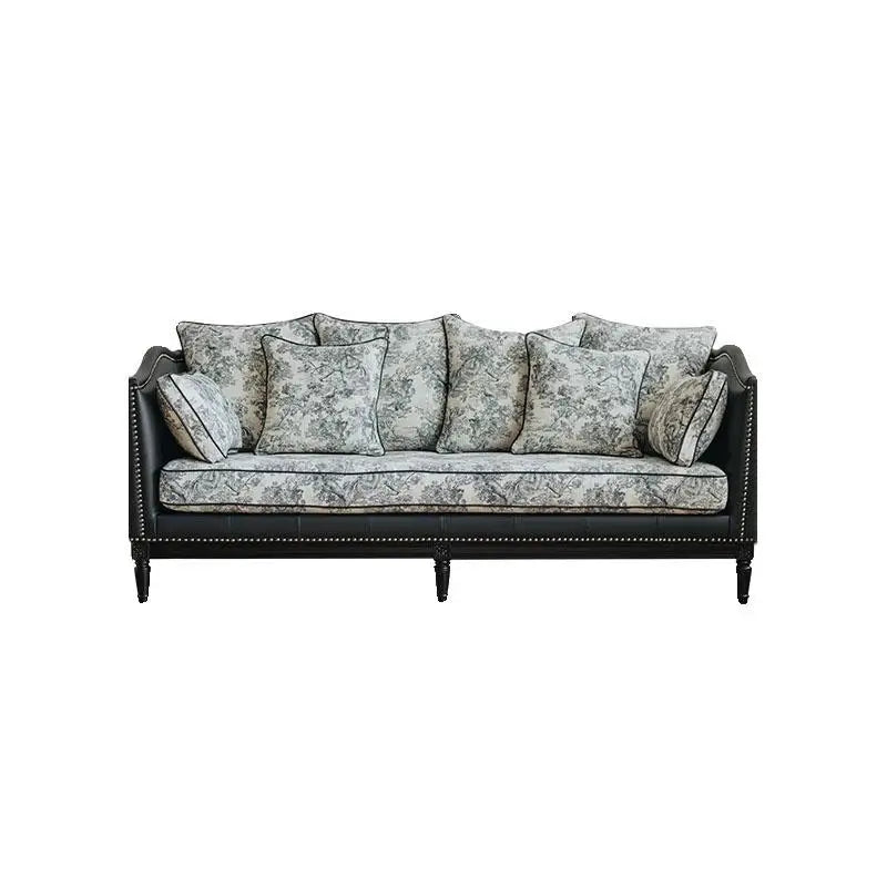 Decorative sofa with patterned cushions on a white background