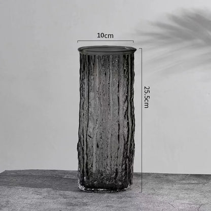 Cylindrical vase with measurements on a gray background