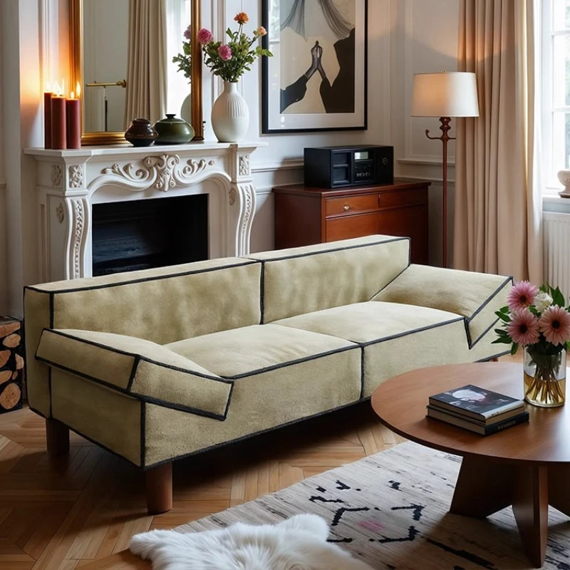 Living room with beige sectional sofa, wooden coffee table, and decorative elements.