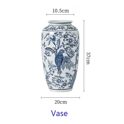 Ceramic vase with blue floral and parrot pattern, shown with measurements on a white background.