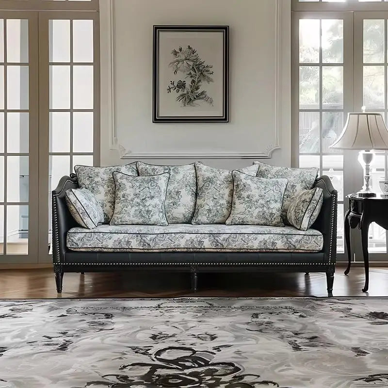 Decorative sofa in a living room with floral pattern and matching pillows.