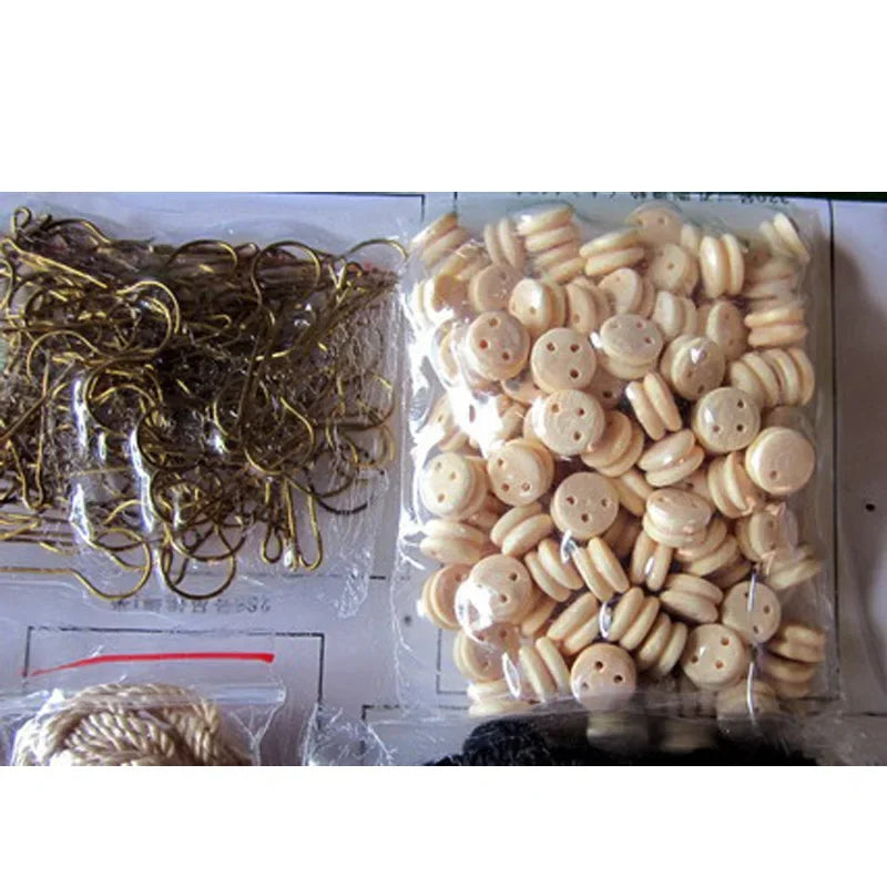 Packaged buttons and metal chain on a white background