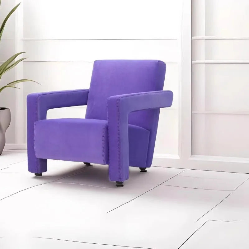 Purple armchair in a room with white walls and tiled floor