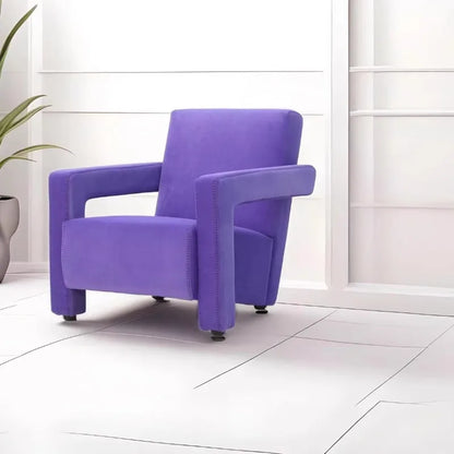 Purple armchair in a room with white walls and tiled floor