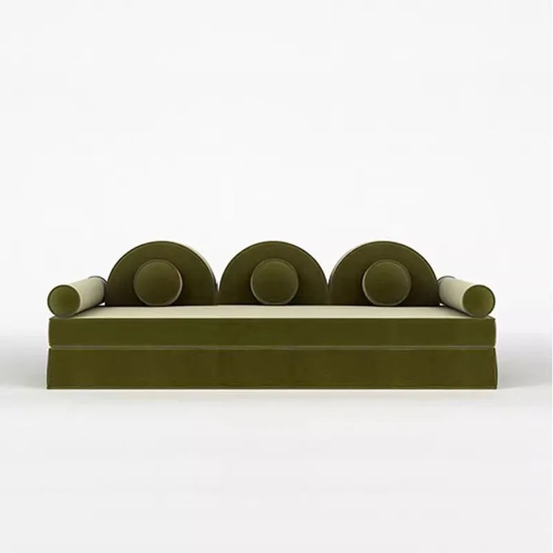 Modern green sofa with circular armrests on a white background