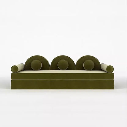 Modern green sofa with circular armrests on a white background