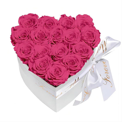 A hand gently holding the MODFIN Eternal Heart Rose Box, showcasing its size and elegance.