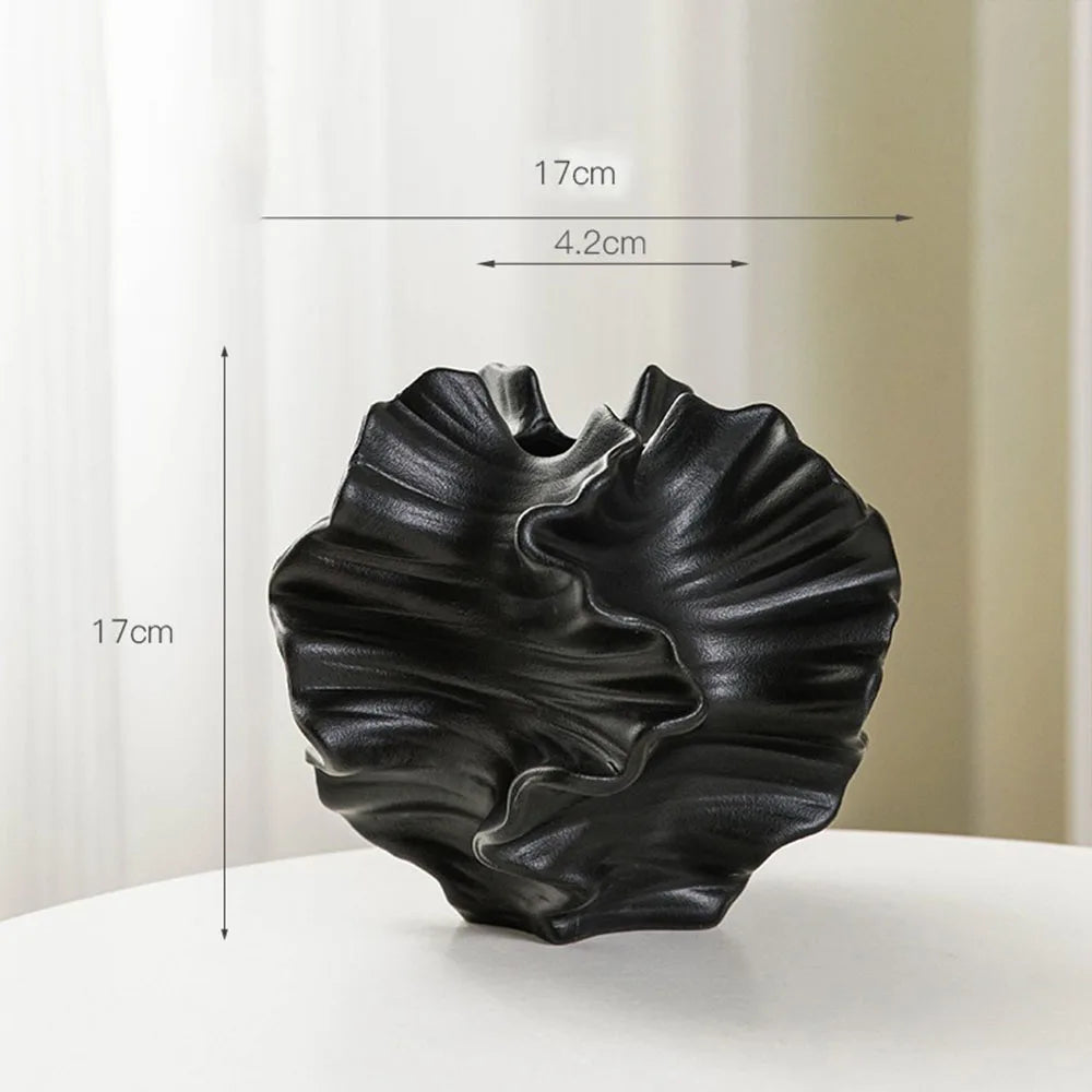 Black textured vase with measurements on a white background