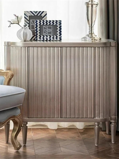 Decorative sideboard with decorative items in a room setting