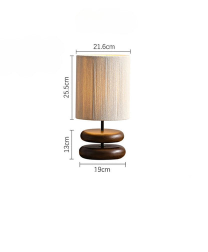 Table lamp with dimensions indicated on a white background